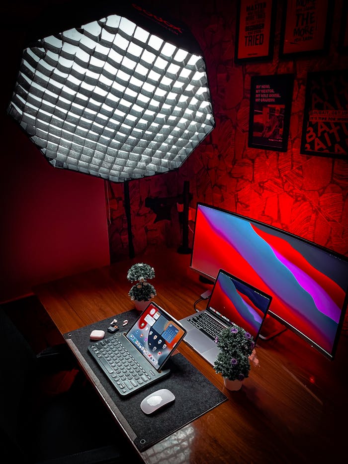 services-04 Stylish home office setup featuring laptops, tablets, and modern lighting for productivity.